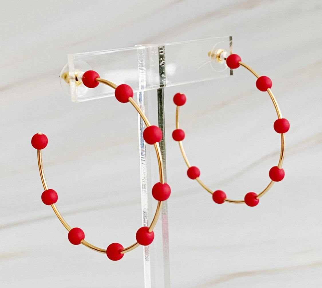 Red beaded hoop earrings